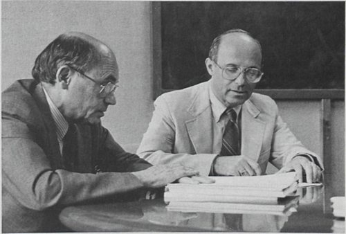 Dr. Martin Malkin, right, Executive Director, Planning and Management, and Dr. Arthur Patchett, left, Vice President of the New Drug Discovery Department, review one of the basic tools of drug discovery—a molecular model of the compound VASOTEC®. A member of MSDRL's project planning and management group since 1974, Dr. Malkin currently oversees a staff of 50 individuals of which 14 coordinate all projects in development