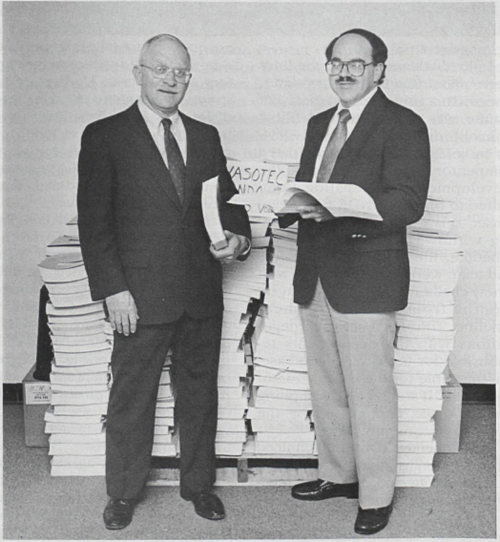 Mr. Richard Rhodes, left, Director, Project Planning and Management, and Dr. John Irvin, right, Executive Director of Cardiovascular Clinical Research, with the 333-volume New Drug Application filing.* The coordination of the massive NDA filing, three subsequent NDA filings, and the Japanese development program fell to Mr. Rhodes throughout the program for VASOTEC®