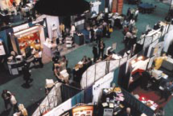 The Expo floor of PMI's 1998 Seminars & Symposium was buzzing with activity, as a record number of vendors vied for the attention of conference goers. The trade show portion of PMI's annual event has become a primary showcase for project management products; many companies now debut new releases at the show
