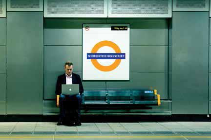 A man waits for a train in London, England