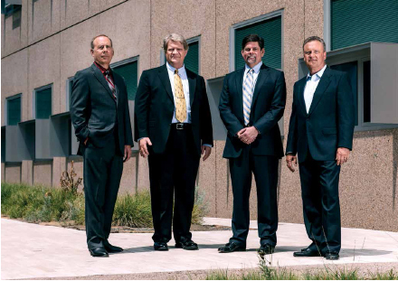 From left, Matt Graham, PMP, federal project director, DoE Golden Field Office; Drew Detamore, PhD, PMP, deputy director of sustainability, infrastructure transformation, engineering and operations, NREL; Ken Powers, chief operating officer and deputy lab director, NREL; and Brian Larsen, PMP, senior project manager, NREL