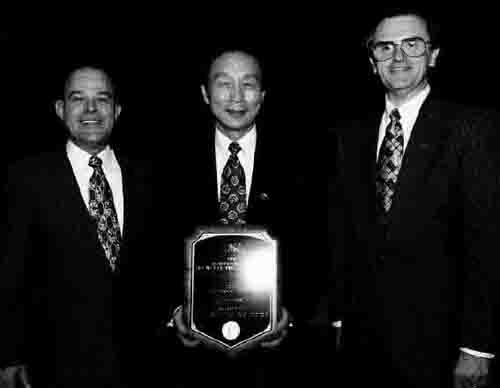 Accepting the Project of the Year Award on behalf of Lucent Technologies at the PMI ‘96 awards ceremony in at PMI ‘96 in Boston, Mass., are (left to right) Paul Rutkowski, PMP, technical manager, Toll Switching R&D Project Management; J. Carl Hsu, vice-president, Advanced Technologies; and Stanley Golinski, manager, Product & Offer Realization, Toll Switching Voice & Signaling