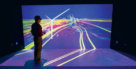 NREL senior scientist Kenny Gruchalla examines the velocity field from a wind turbine simulation at the Insight Collaboration Laboratory at ESIF in Golden, Colorado