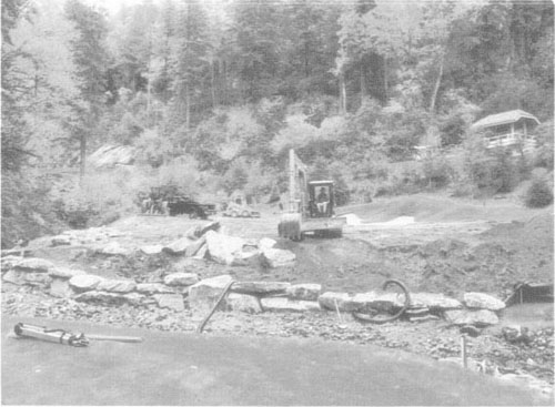 Beginning of the renovation of the fourteenth hole of Highlands Falls Country Club, Highlands, NC, showing the installation of a retaining wall around the green