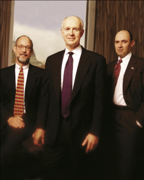 The DoE's Environmental Management Division performs a variety of projects, and a project management career track helps develop the best leaders. Above, Thad Konopnicki, Bruce M. Carnes, Office of Management director, and James A. Rispoli, Office of Engineering acting director, help direct DoE projects
