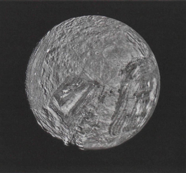 Nine images were combined to creat this mosiac of Miranda. The moon's surface consists of two strikingly different types of terrain: old, heavily cratered areas and young, complex regions characterized by scarps and ridges