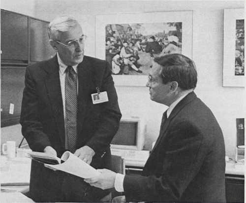 Dr. John Engelhart, left, Director, Project Planning and Management, and Dr. Victor Grenda, right, Senior Director of Process Research, consider alternate process chemistries of VASOTEC® that will facilitate the time and cost-effective production of bulk drug quantities sufficient to meet various preclinical and clinical study requirements. Himself the author of 27 U.S. patents, Dr. Engelhart brought a thorough understanding of pharmaceutical science to his role as prime coordinator of the project for the development of VASOTEC®
