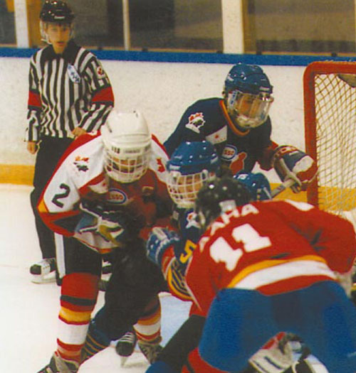 Marina Zenk's first major milestone in her path to the Olympics was to successfully officiate games on the national level. Here she is shown refereeing a National Championship game between New Brunswick and Alberta in March 1997